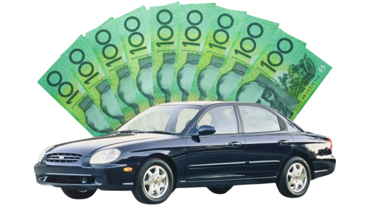 Photo of an old car with a lot of cash behind it